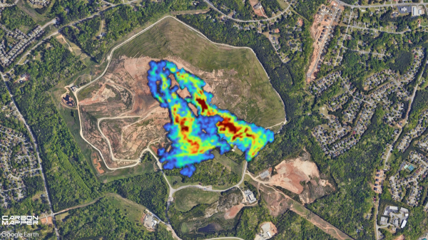 Aerial view of a landfill with an area where methane is being emitted highlighted in blue, green, yellow and red.